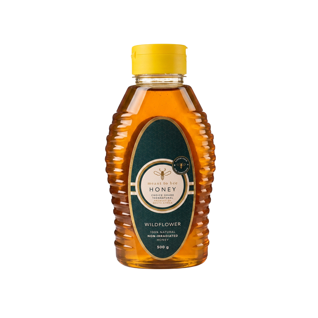 A squeeze bottle of Meant To Bee Wildflower honey, filled with amber honey and topped with a yellow cap.